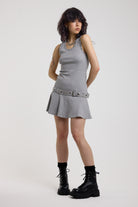 Grey mini dress with silver stud detail and eyelet detail belt, worn by model