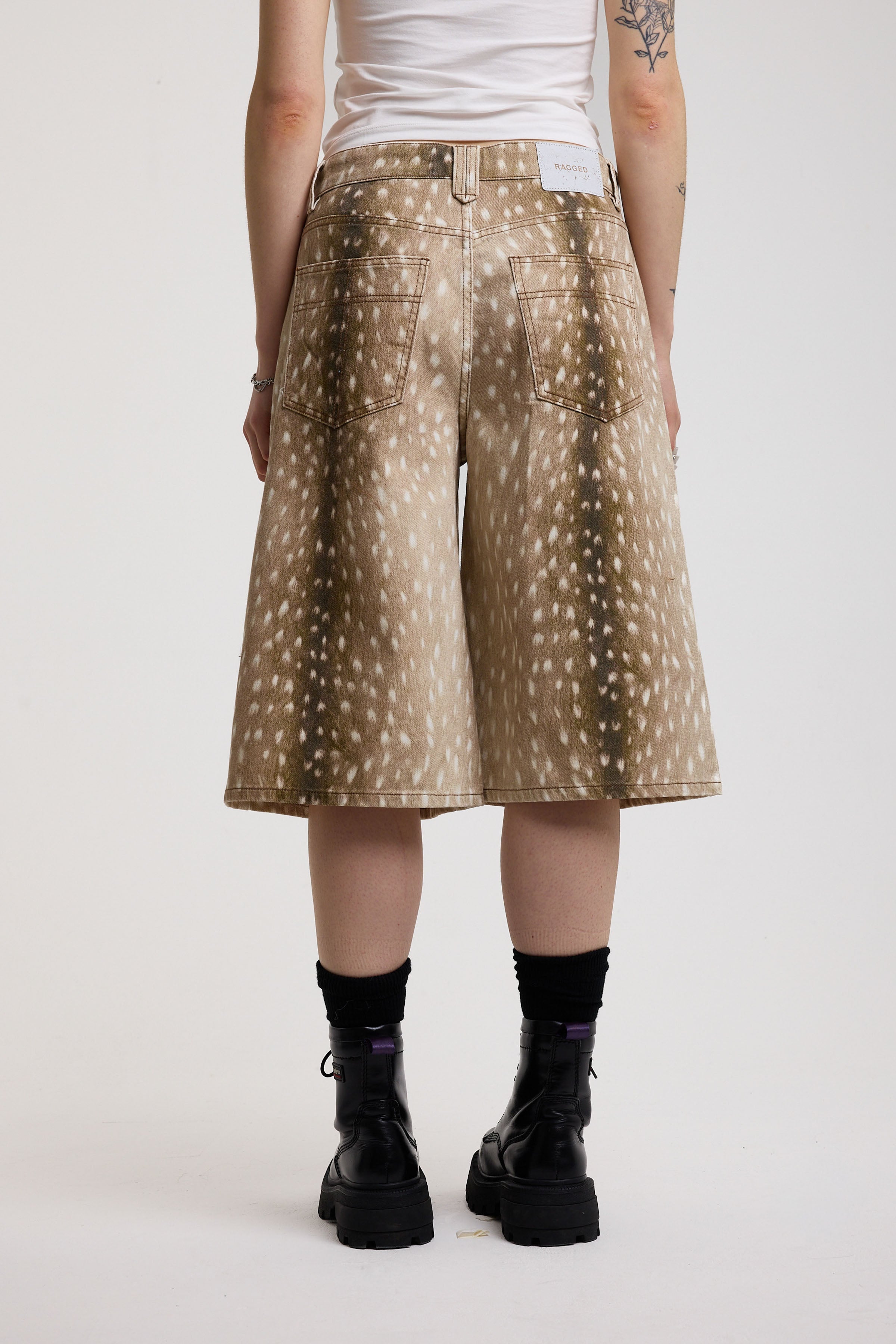 Baggy wide leg denim jorts in all over deer print, worn by model