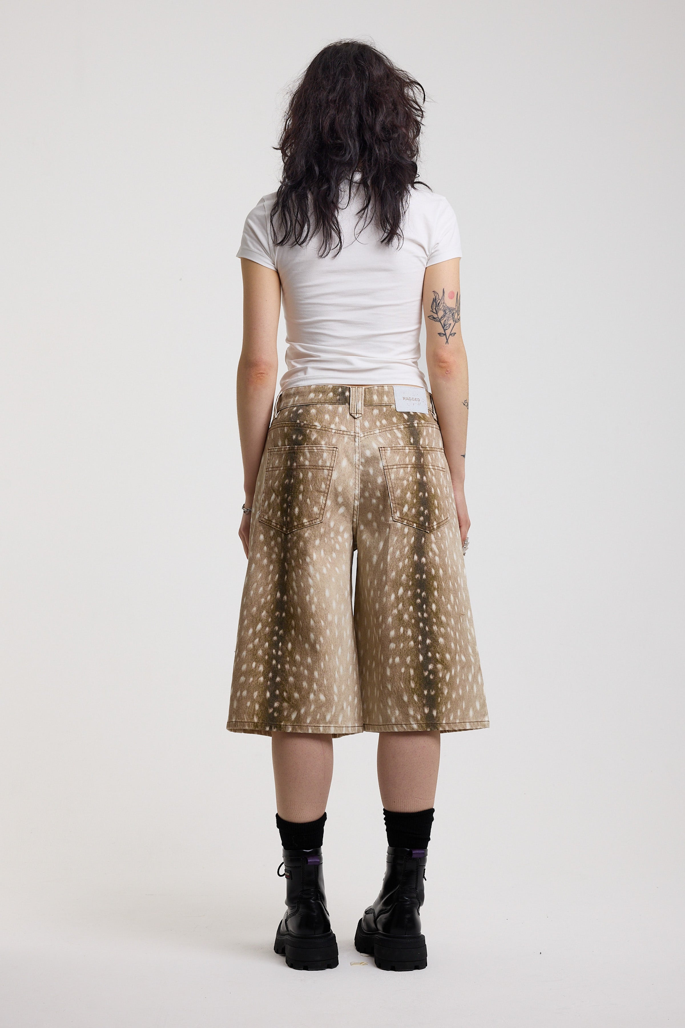 Baggy wide leg jorts in all over deer print, worn by model