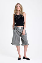 Green and yellow gingham longline boxer shorts, relaxed capri pants, with elasticated waistband and ruffle hem, worn by model