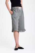 Green and yellow gingham longline boxer shorts, relaxed capri pants, with elasticated waistband and ruffle hem, worn by model