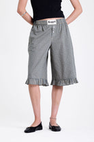 Green and yellow gingham longline boxer shorts, relaxed capri pants, with elasticated waistband and ruffle hem, worn by model