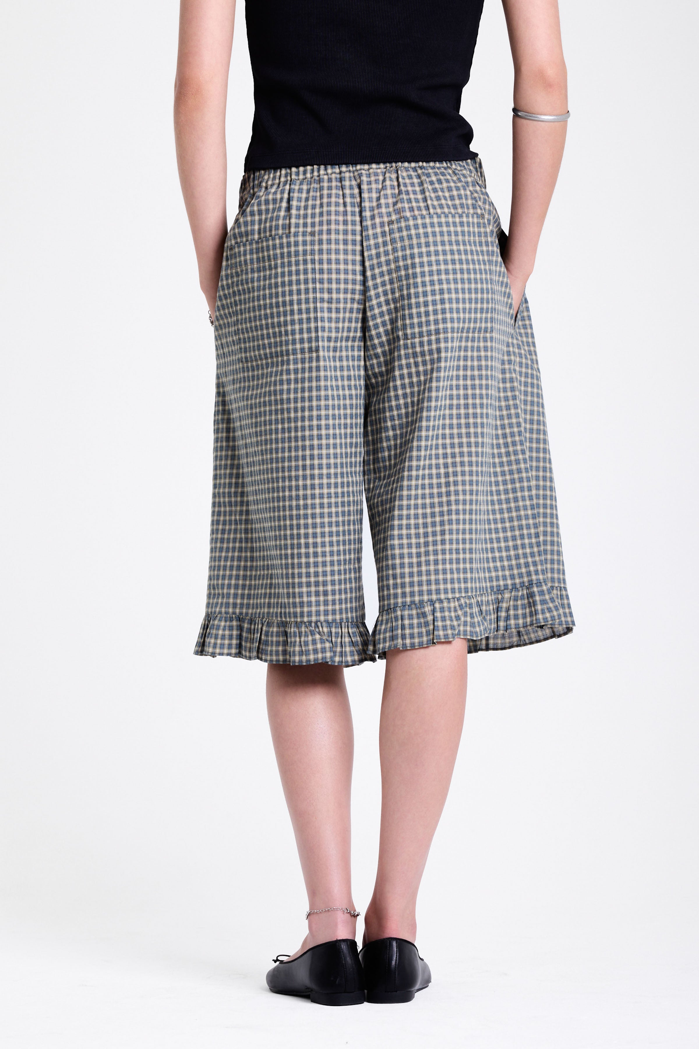 Green and yellow gingham longline boxer shorts, relaxed capri pants, with elasticated waistband and ruffle hem, worn by model