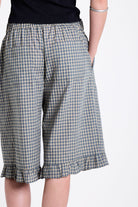 Green and yellow gingham longline boxer shorts, relaxed capri pants, with elasticated waistband and ruffle hem, worn by model