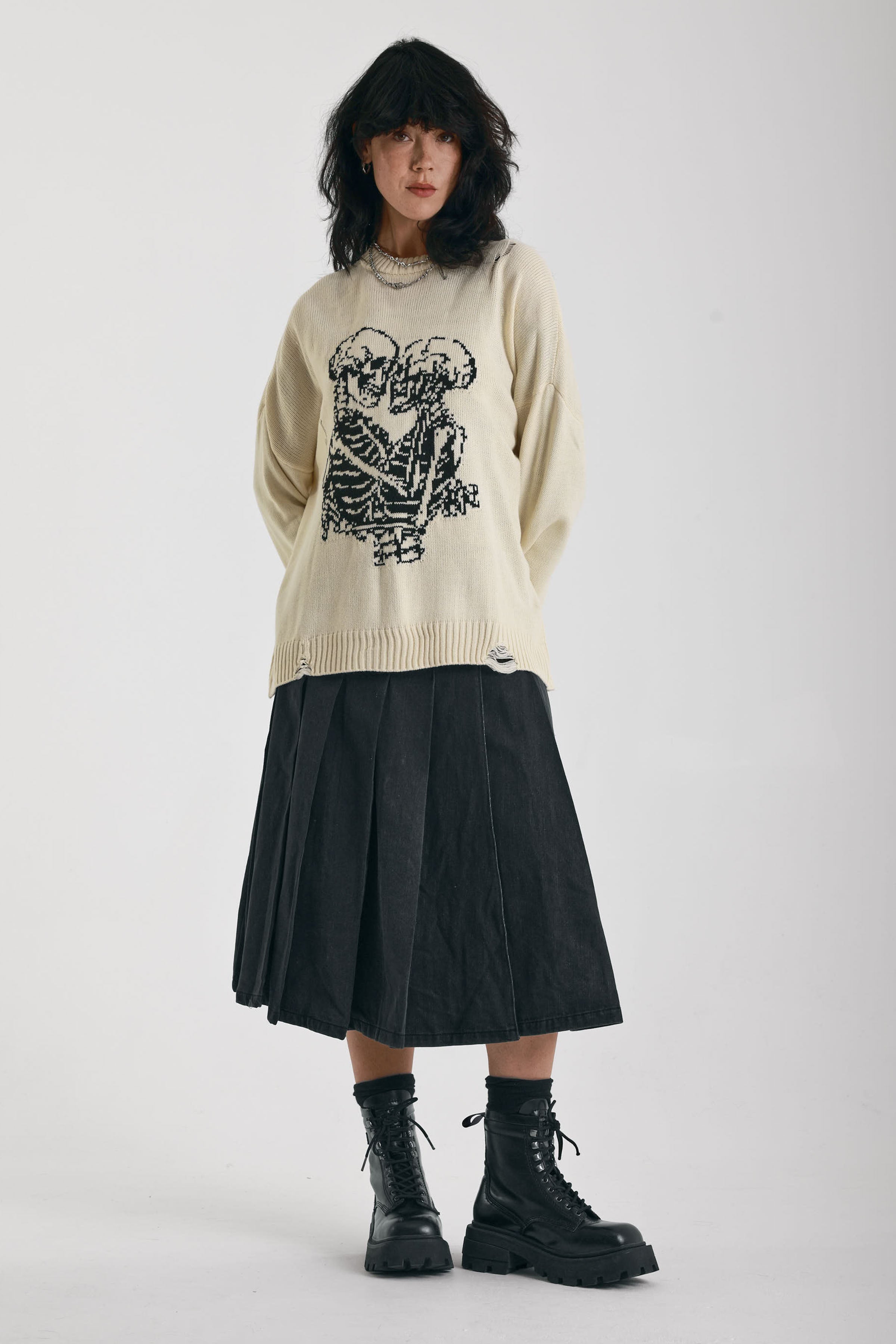 Cream oversized knit jumper with skeleton graphic, worn by model