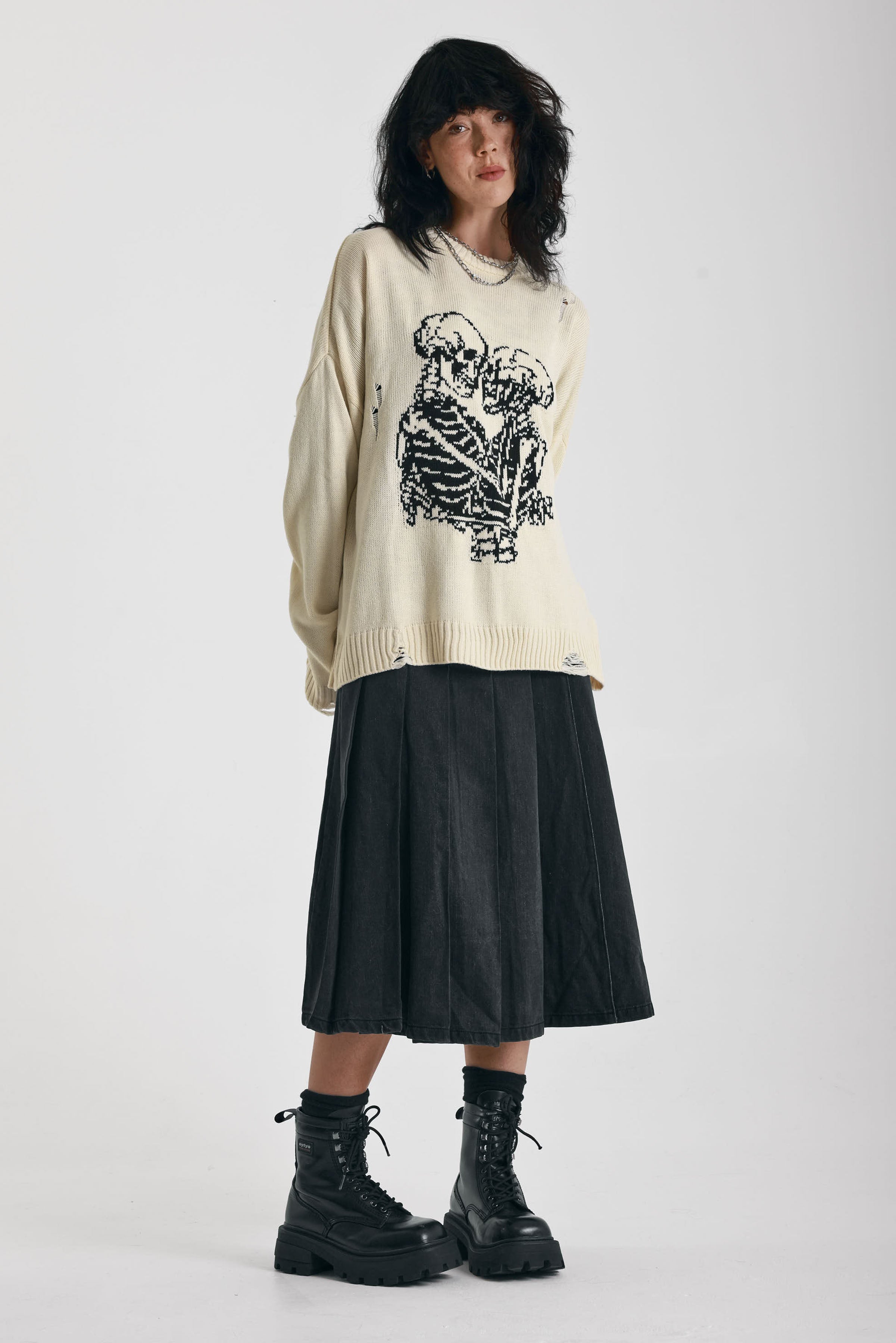 Cream oversized knit jumper with skeleton graphic, worn by model