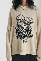 Cream oversized knit jumper with skeleton graphic, worn by model