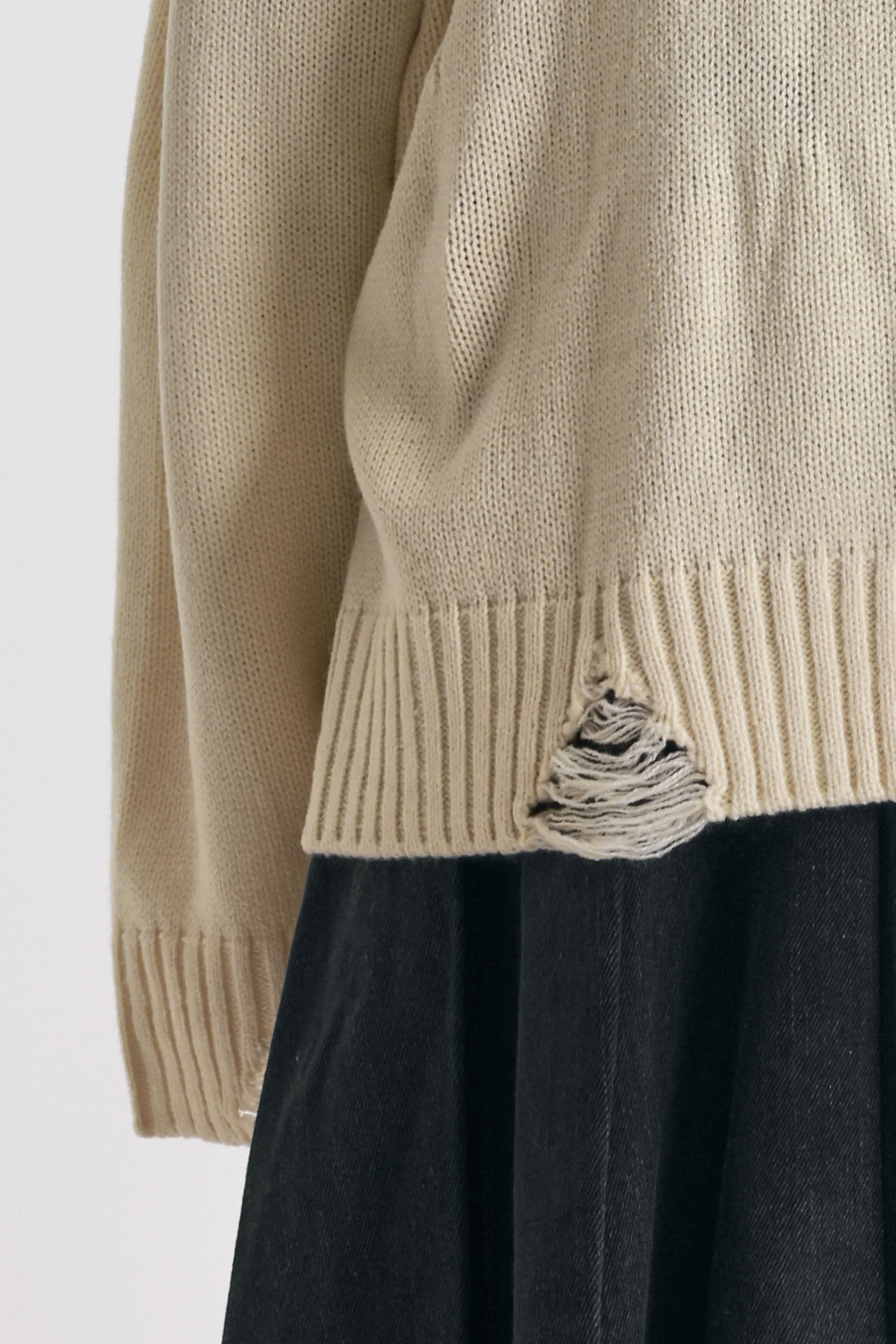 Cream oversized knit jumper with skeleton graphic, worn by model
