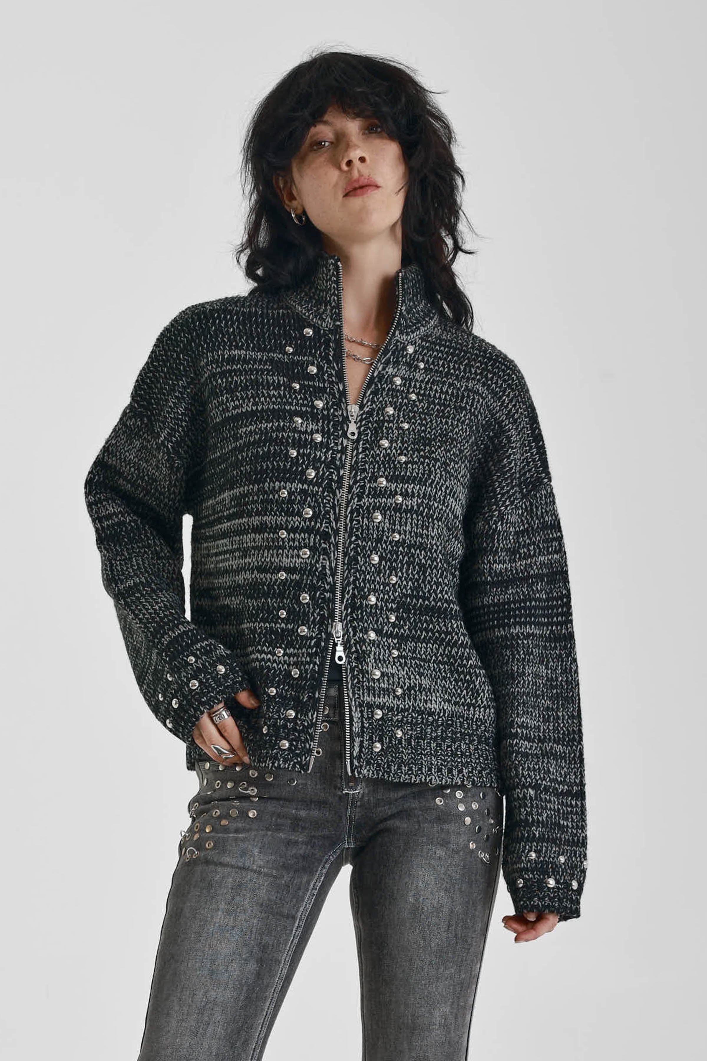 Black and grey chunky spacedye knit zip through cardigan with silver studs, worn by model