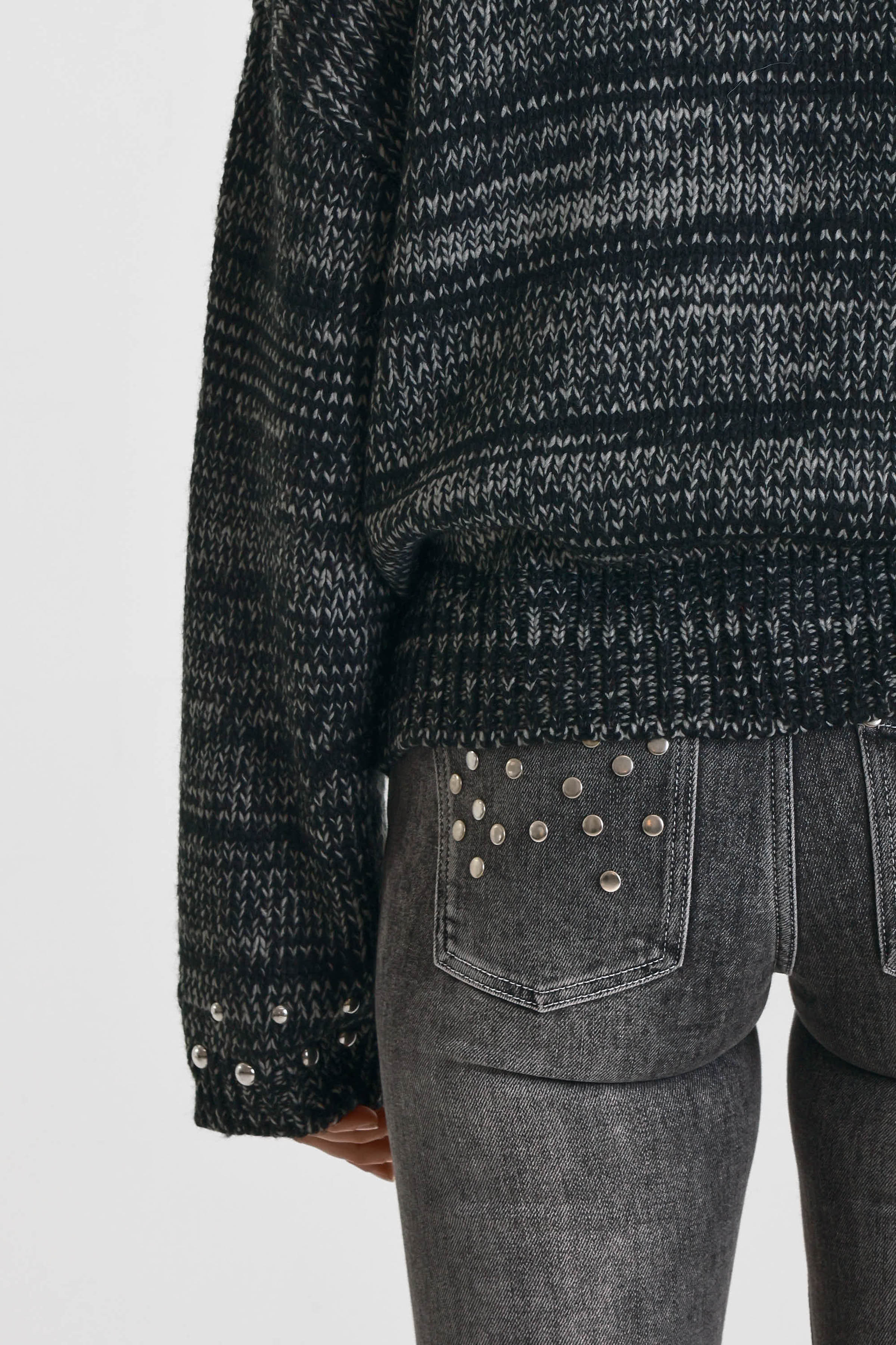 Black and grey chunky spacedye knit zip through cardigan with silver studs, worn by model