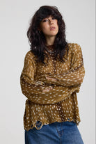 Brown deer print oversized knit jumper with grunge distressed details, worn by model