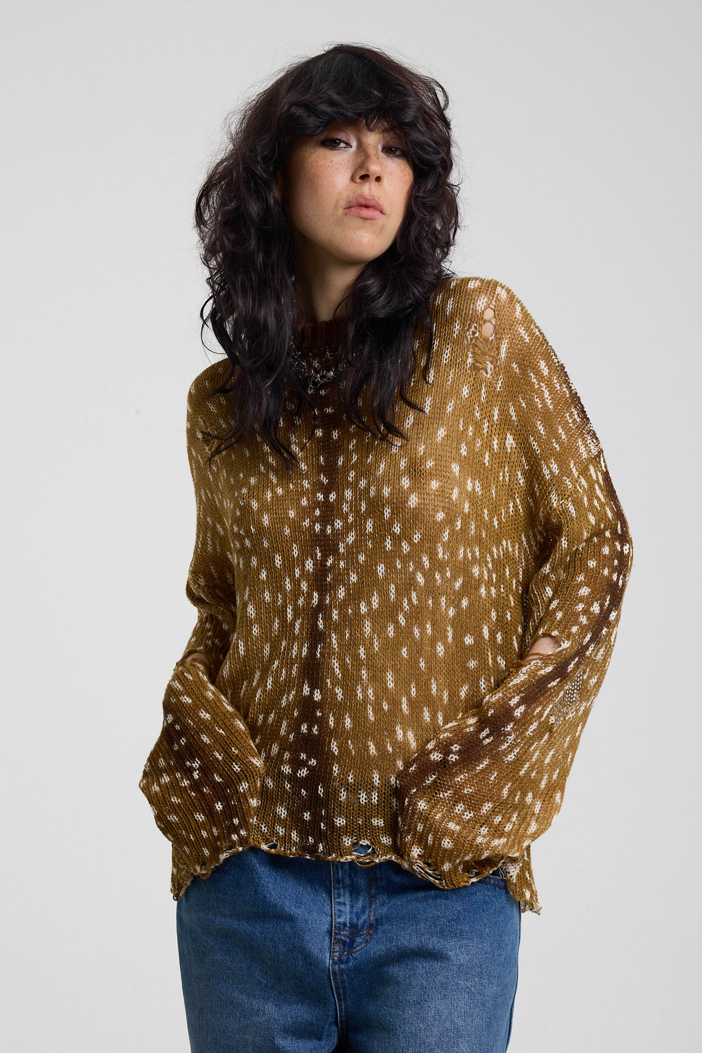 Brown deer print oversized knit jumper with grunge distressed details, worn by model