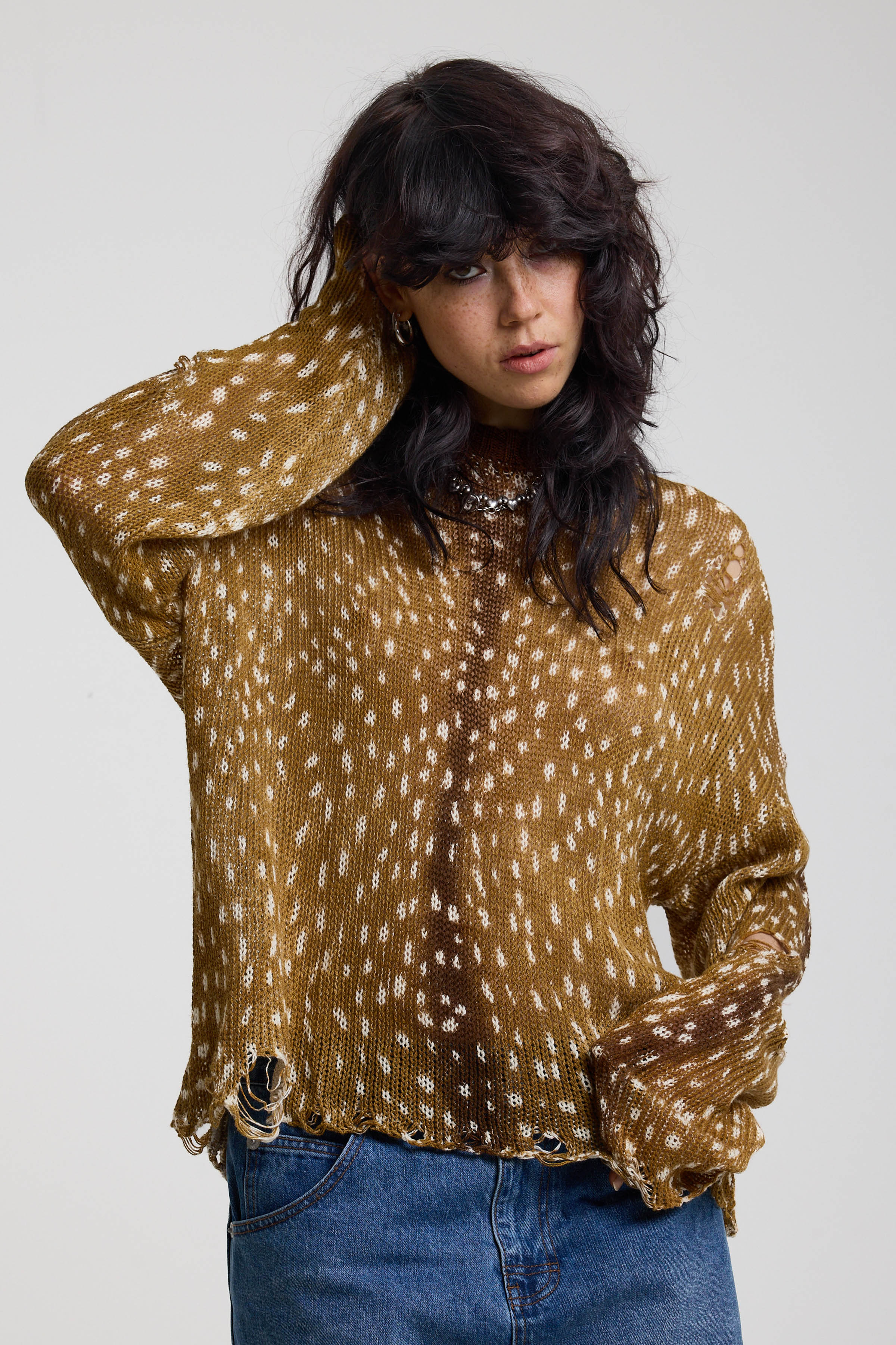 Brown deer print oversized knit jumper with grunge distressed details, worn by model