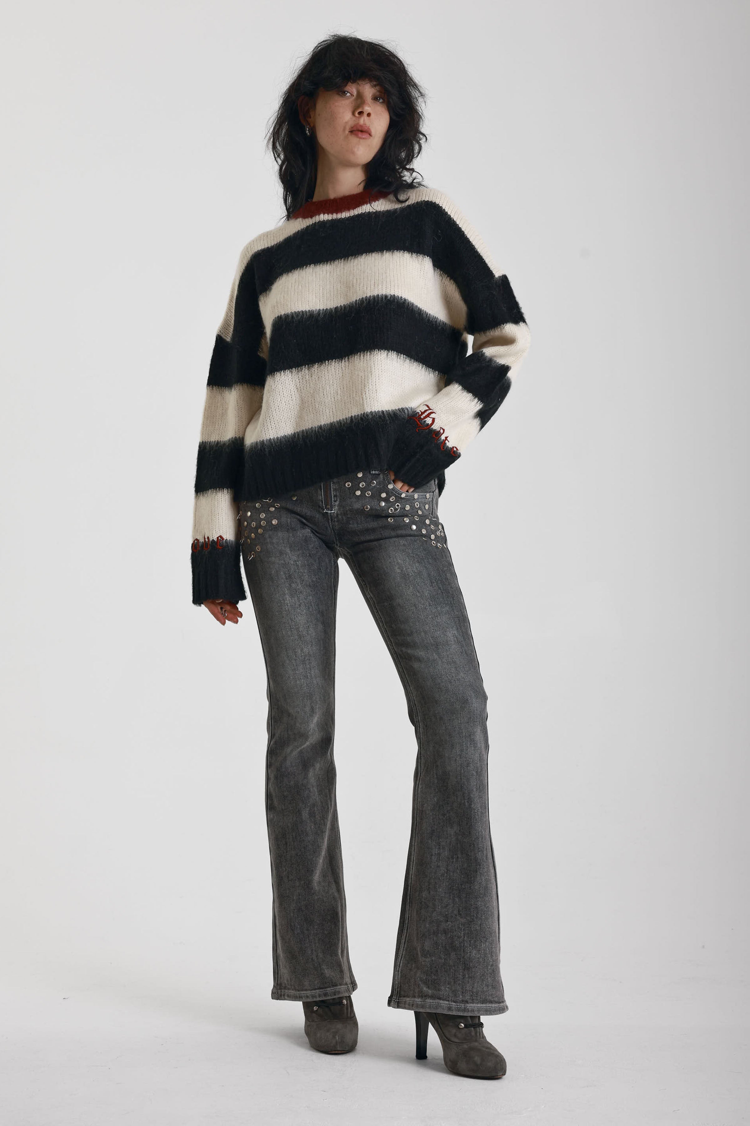 Black and white stripe fluffy knit jumper with burgundy crew neck, worn by model