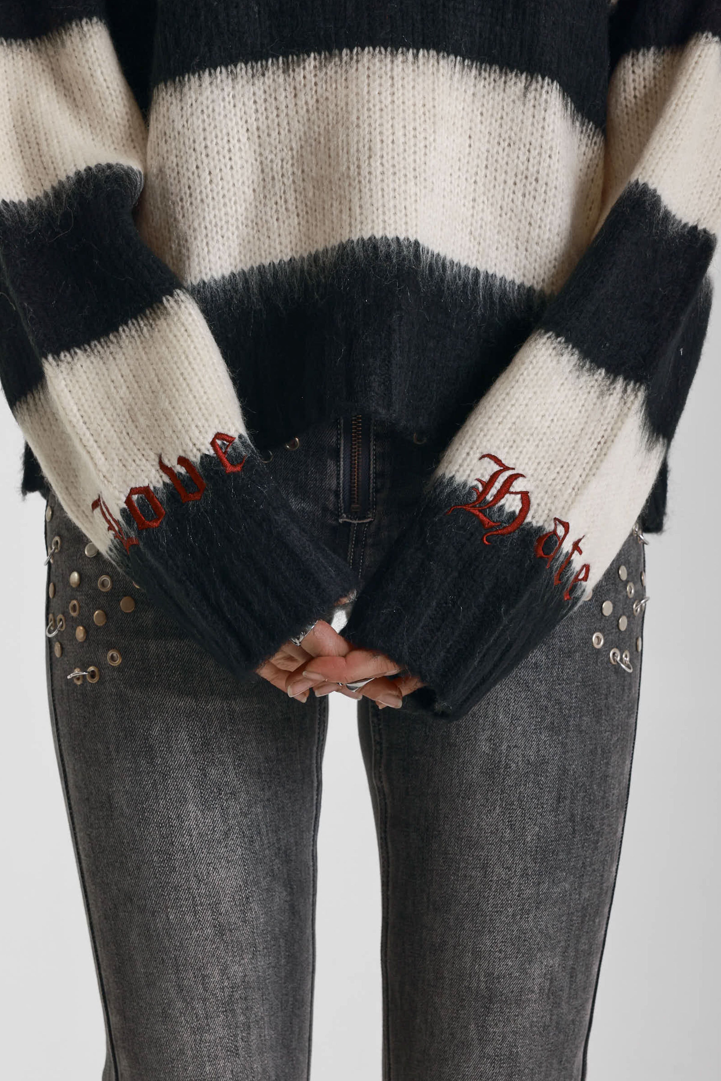 Black and white stripe fluffy knit jumper with burgundy crew neck, worn by model