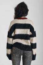 Black and white stripe fluffy knit jumper with burgundy crew neck, worn by model