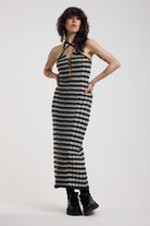 Black and grey textured stripe knit maxi dress with cut out front and silver hardware, worn by model