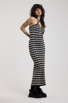 Black and grey textured stripe knit maxi dress with cut out front and silver hardware, worn by model