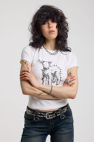 White shrunken baby t-shirt with spiked lamb graphic print, worn by a model