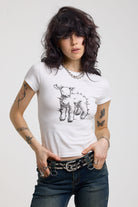 White shrunken baby t-shirt with spiked lamb graphic print, worn by a model