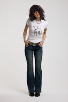 White shrunken baby t-shirt with spiked lamb graphic print, worn by a model