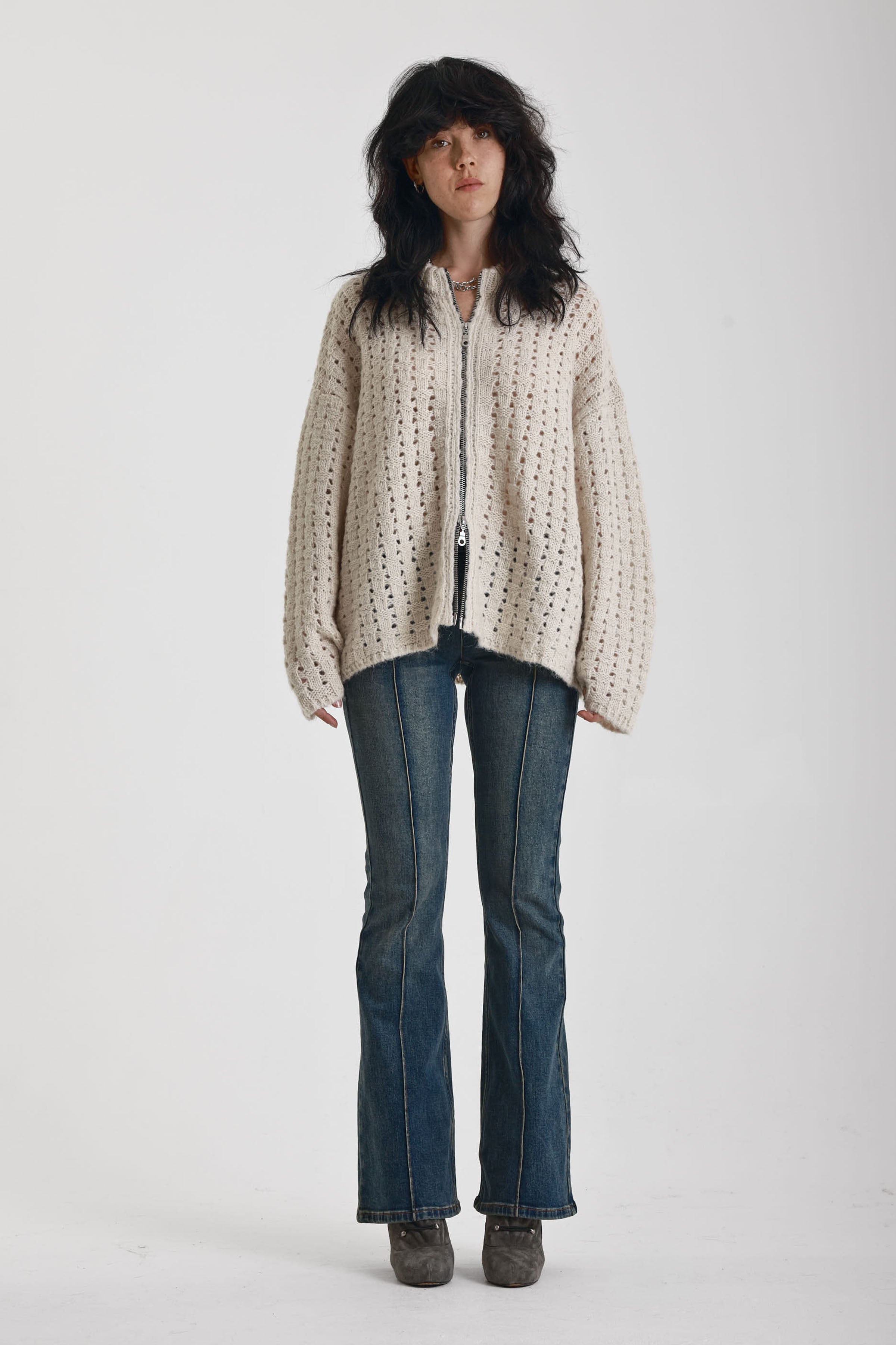Off white open knit oversized cardigan with zip, worn by model