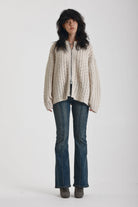 Off white open knit oversized cardigan with zip, worn by model