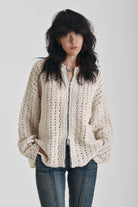 Off white open knit oversized cardigan with zip, worn by model