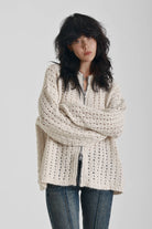 Off white open knit oversized cardigan with zip, worn by model