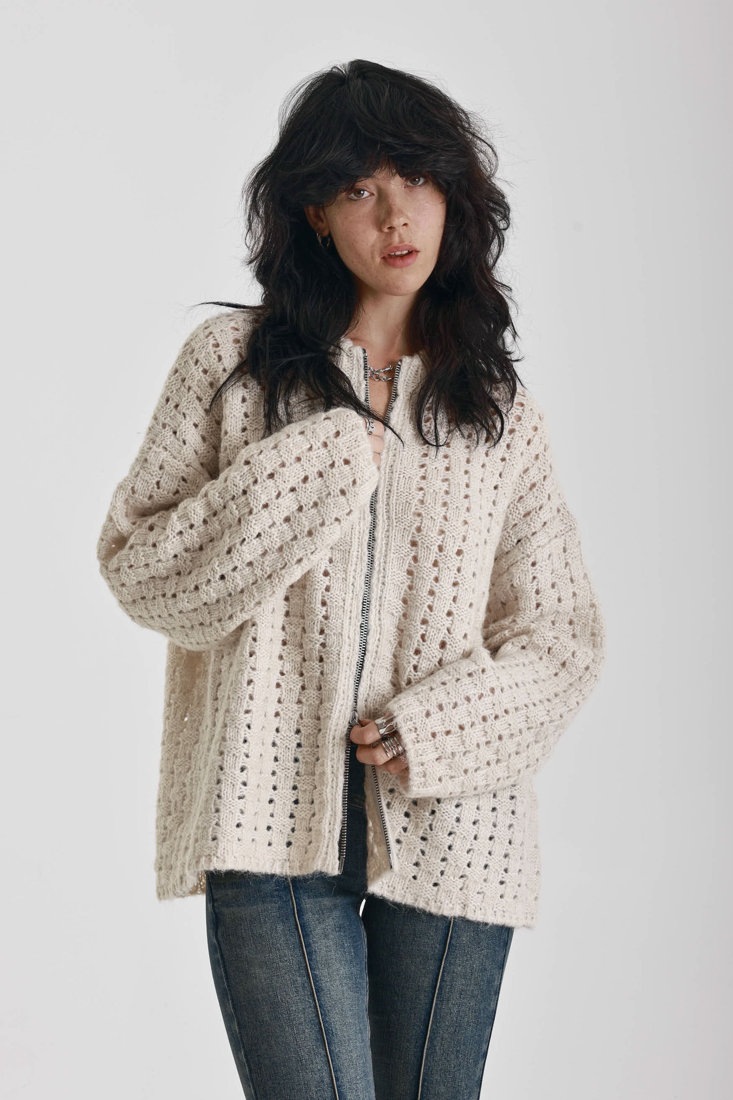 Off white open knit oversized cardigan with zip, worn by model