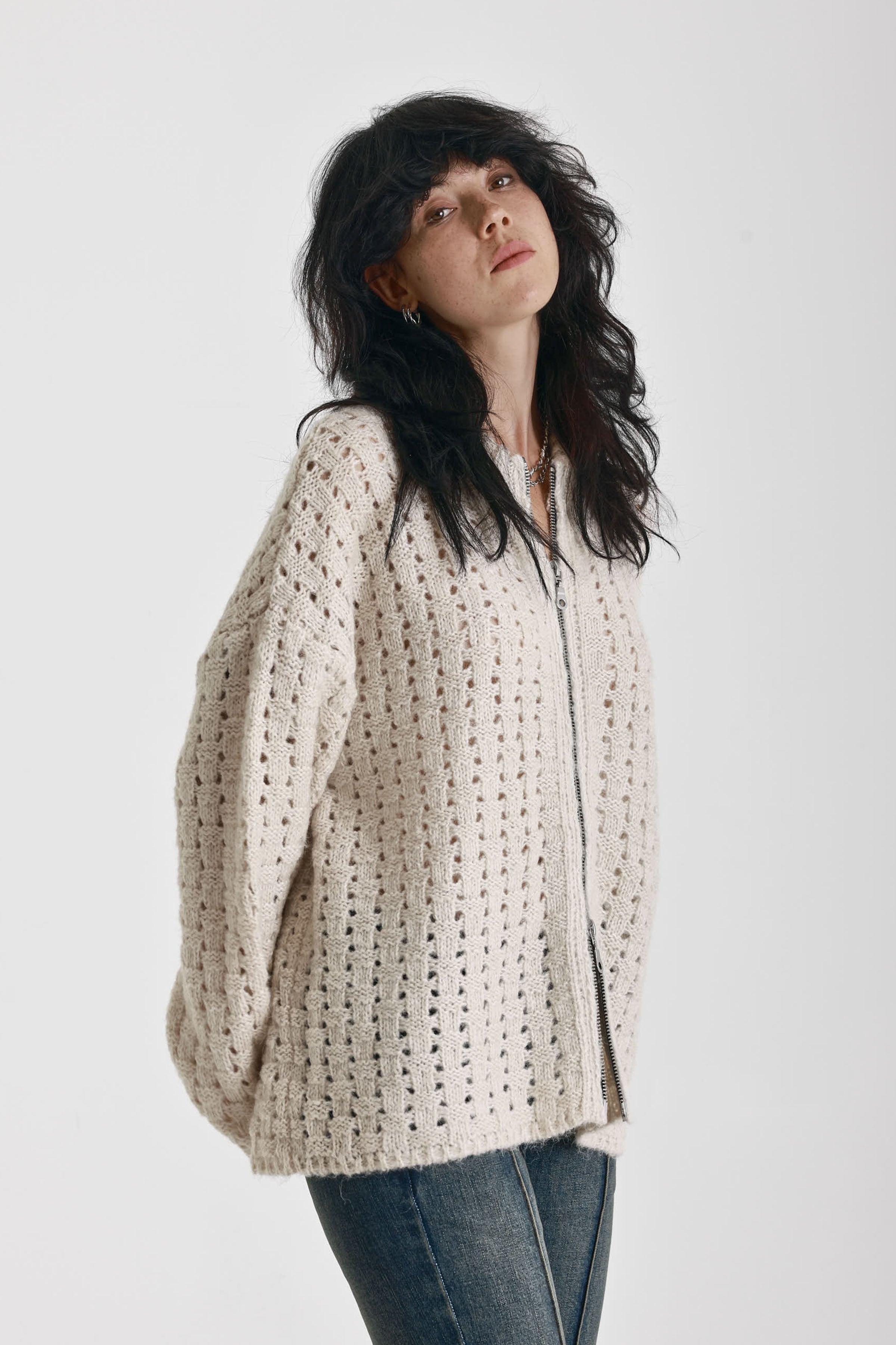 Off white open knit oversized cardigan with zip, worn by model