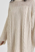 Ecru cable knit chunky knitted mini dress, worn by model