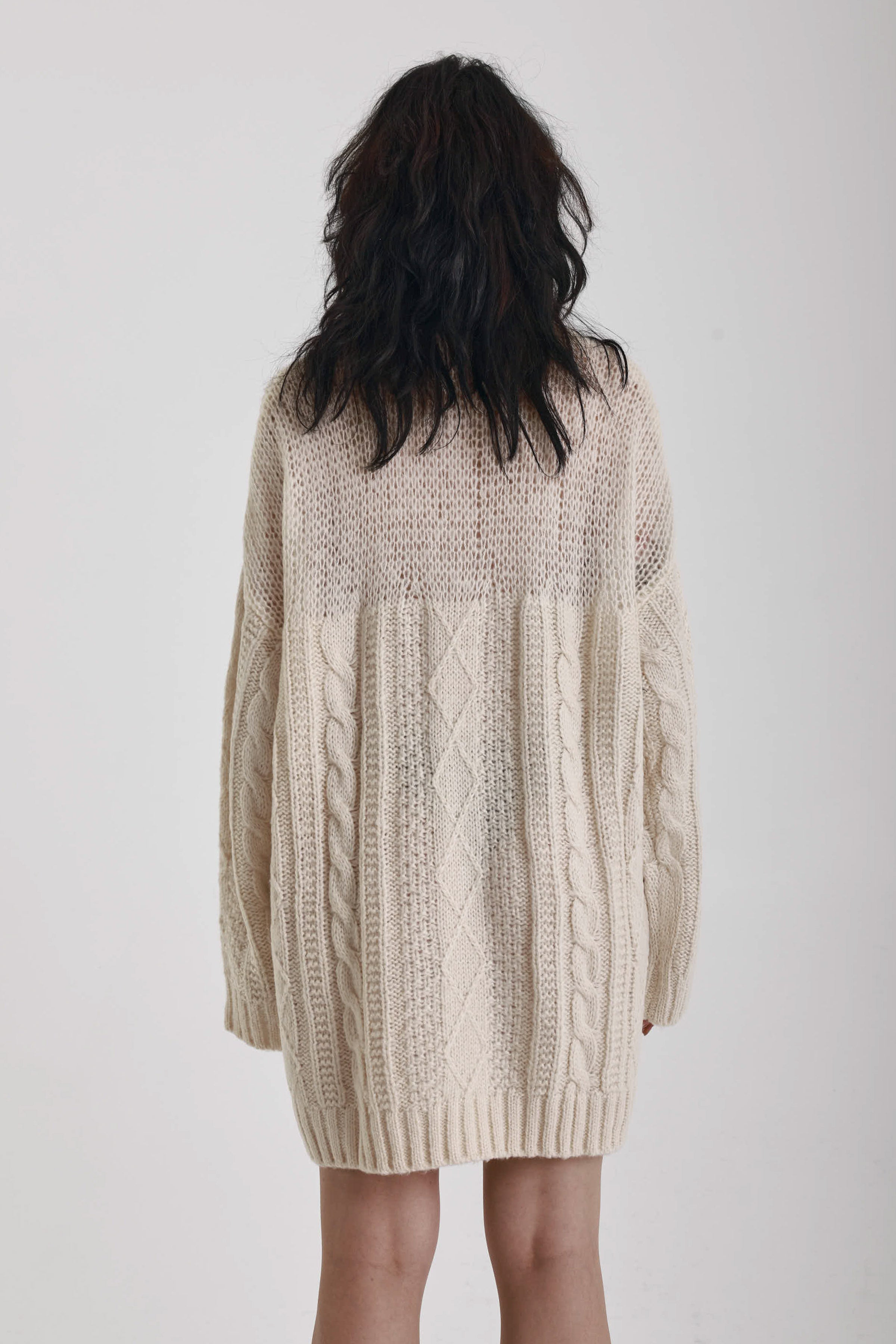 Ecru cable knit chunky knitted mini dress, worn by model