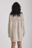 Ecru cable knit chunky knitted mini dress, worn by model