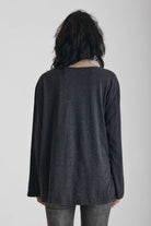 Washed black slouchy fit long sleeve t-shirt with skeleton ribcage burnout graphic, worn by model