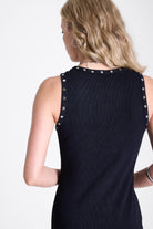 Black bodycon maxi dress with silver stud and piercing detail, worn by model