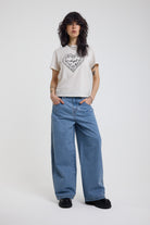 Blue gingham checked baggy wide leg release jeans, worn by model