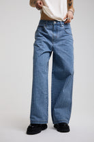Blue gingham checked baggy wide leg release jeans, worn by model
