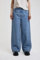 Blue gingham checked baggy wide leg release jeans, worn by model