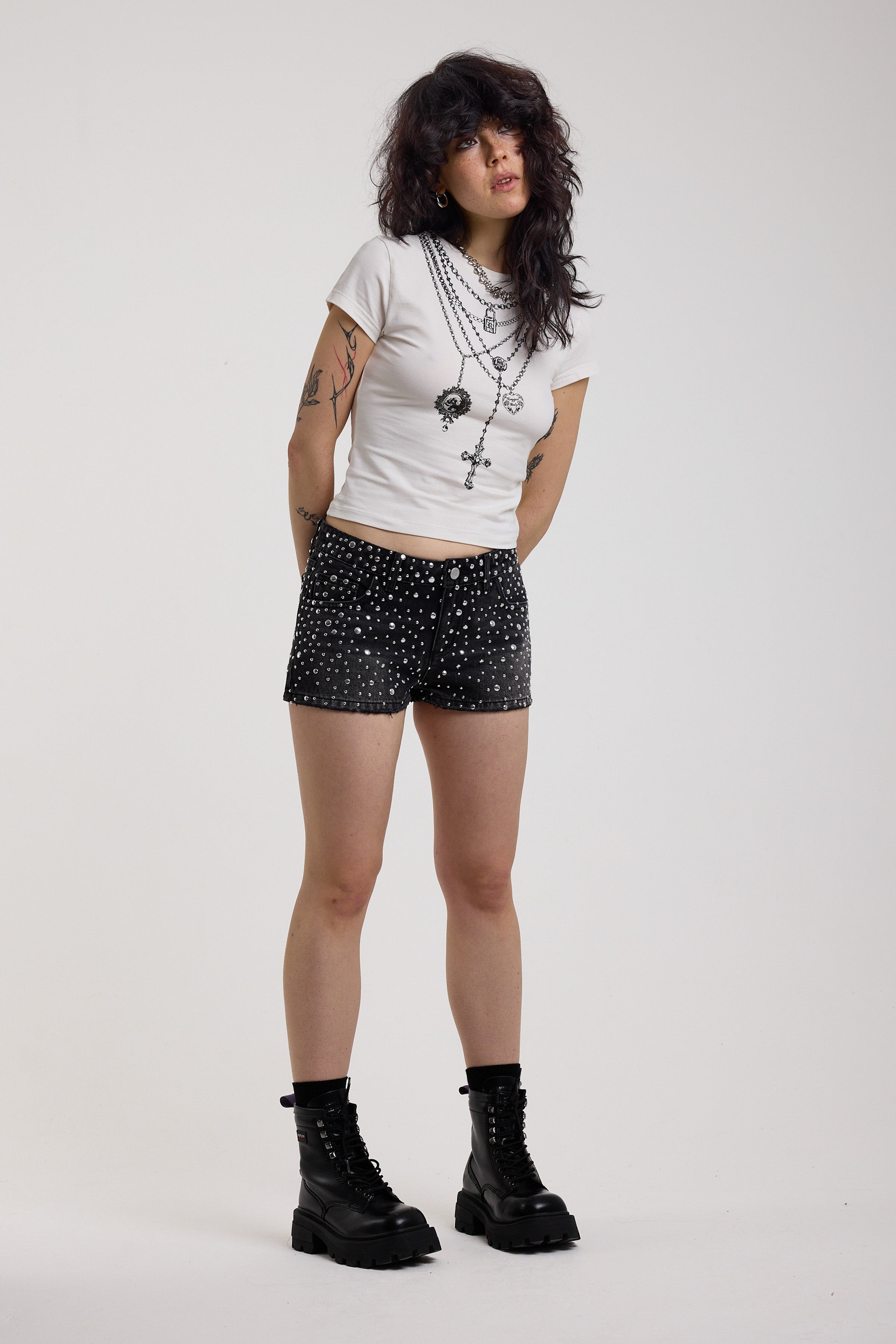 Black denim hotpants with all over hot fix silver studs, worn by model