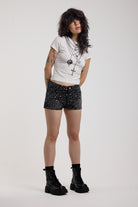 Black denim hotpants with all over hot fix silver studs, worn by model