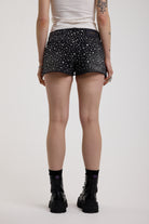 Black denim hotpants with all over hot fix silver studs, worn by model