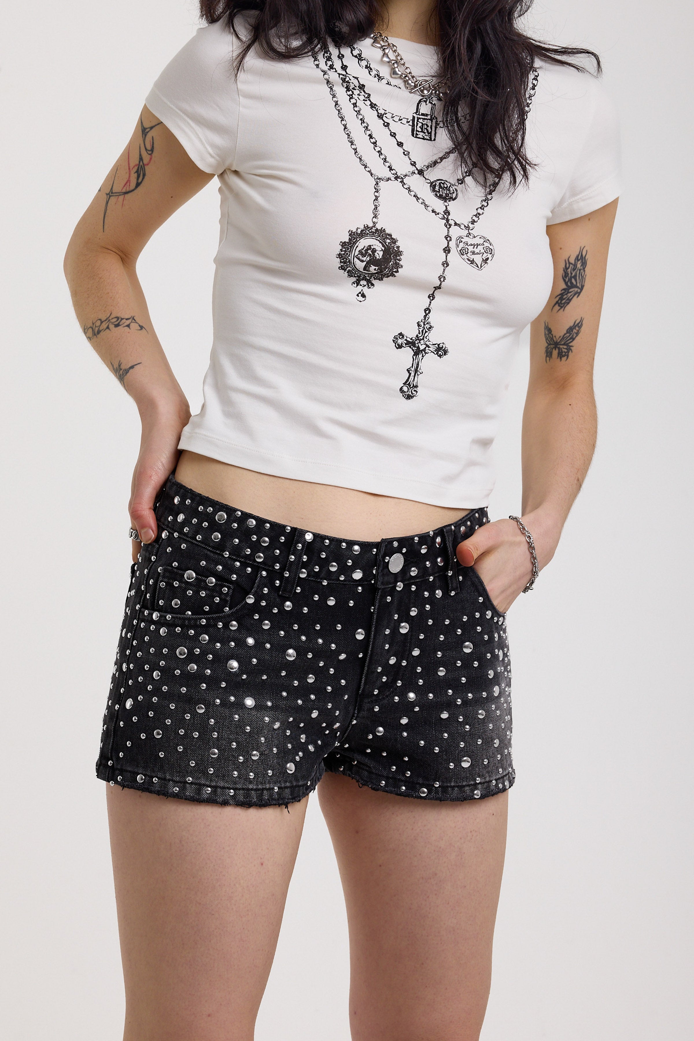 Black denim hotpants with all over hot fix silver studs, worn by model