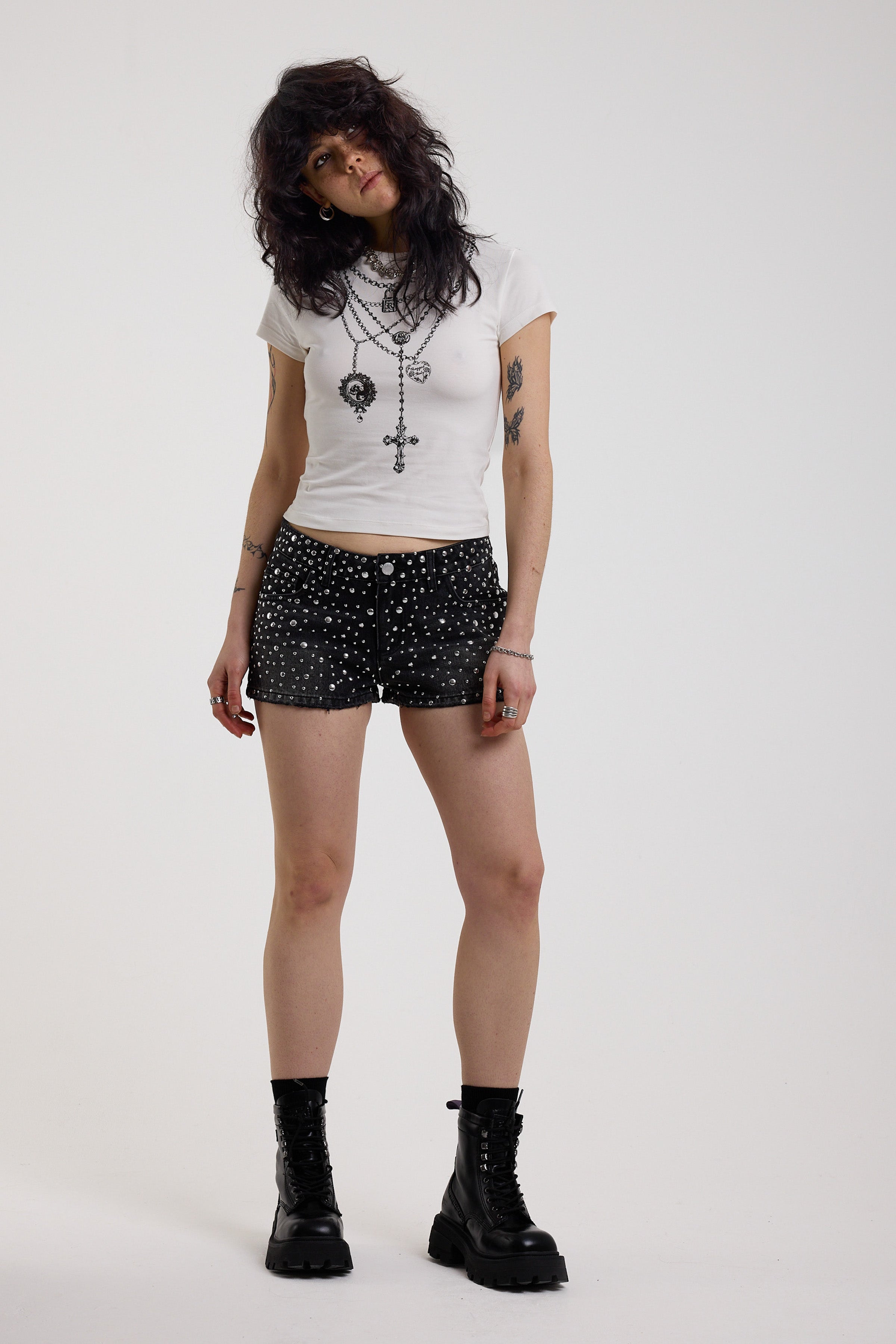 Black denim hotpants with all over hot fix silver studs, worn by model