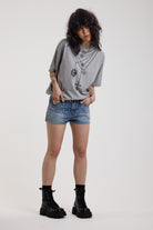 Light wash denim hotpants with all over hot fix silver studs, worn by model