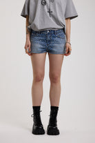 Light wash denim hotpants with all over hot fix silver studs, worn by model