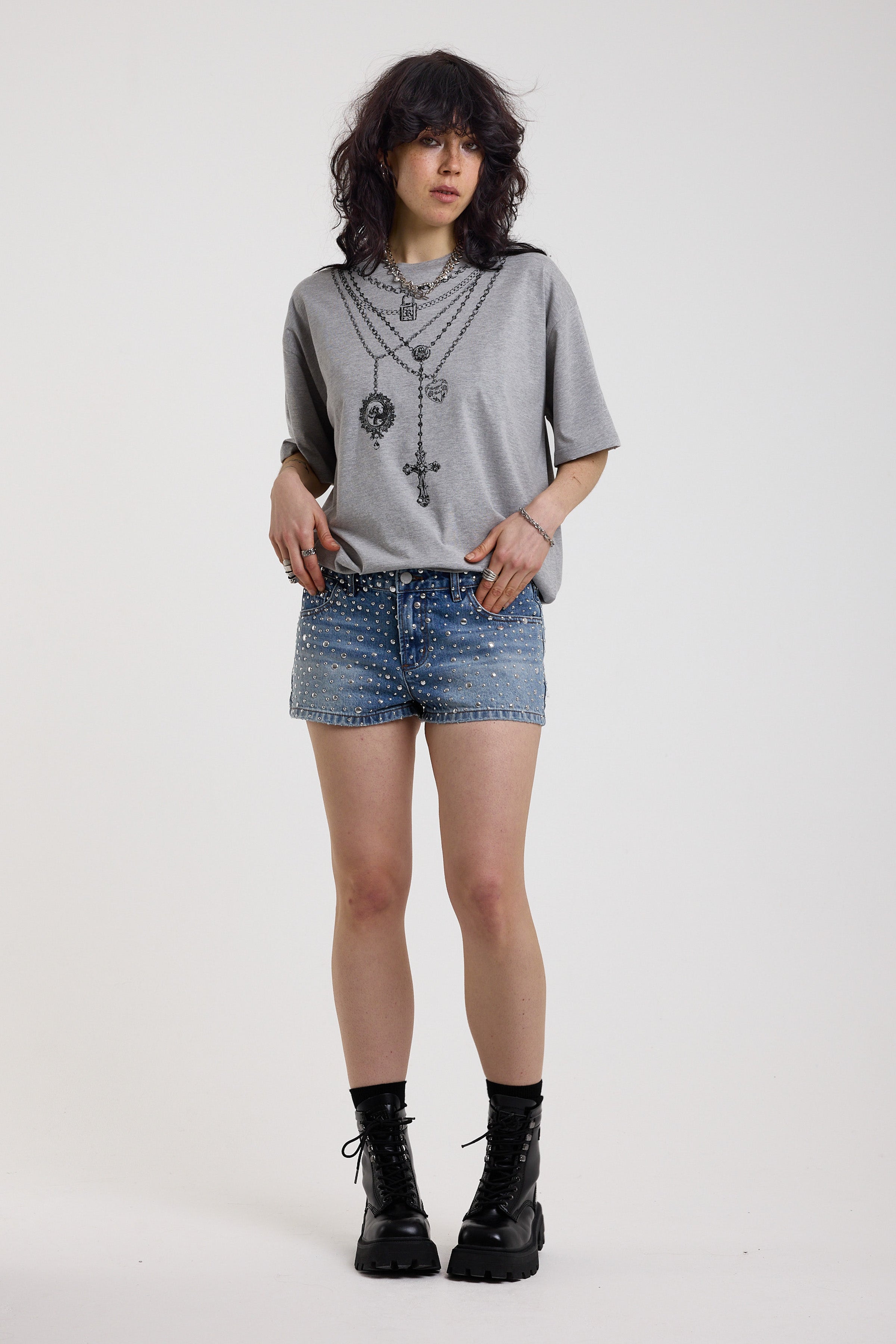 Light wash denim hotpants with all over hot fix silver studs, worn by model