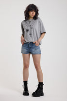 Light wash denim hotpants with all over hot fix silver studs, worn by model