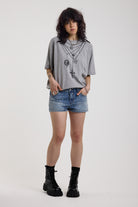 Light wash denim hotpants with all over hot fix silver studs, worn by model
