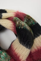 Mixed black, cream, pink and green stripe textured knit oversized blanket scarf, worn by model.